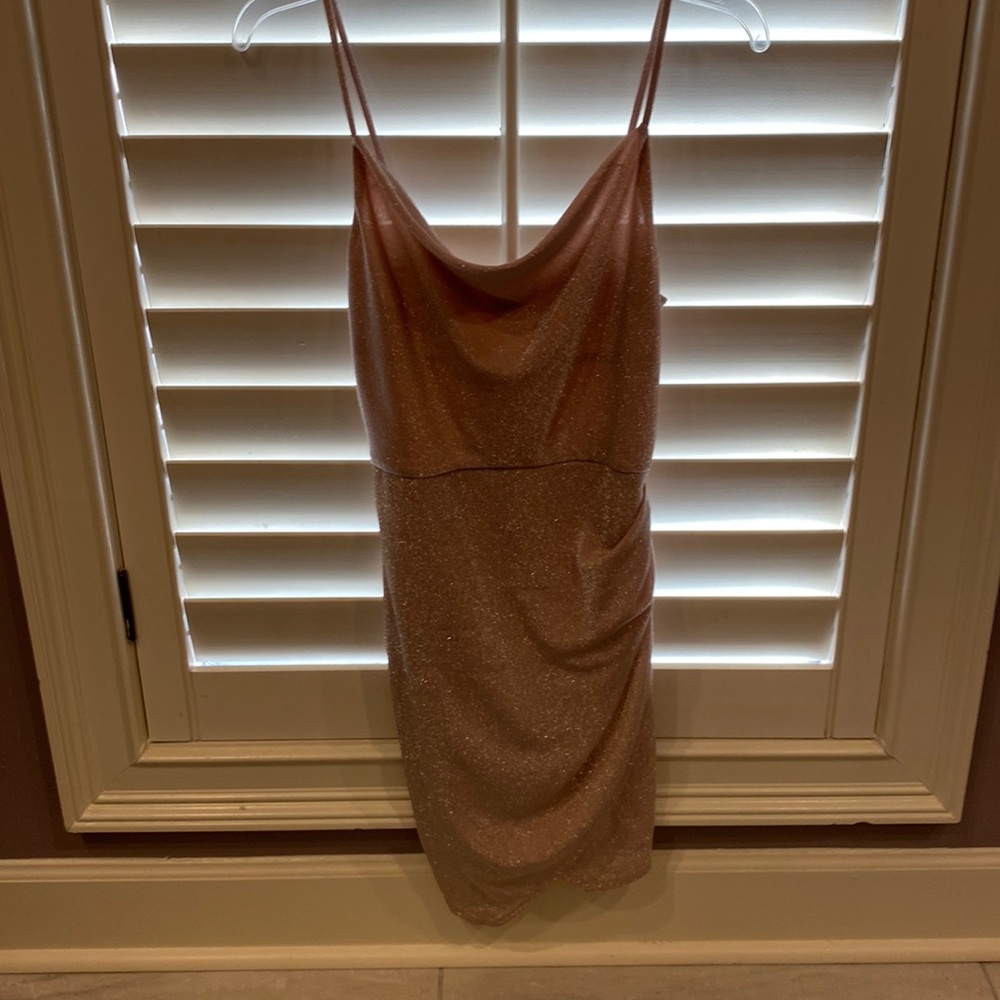 This is a light pink sparkly dress. It is a size 5 and worn once,good condition